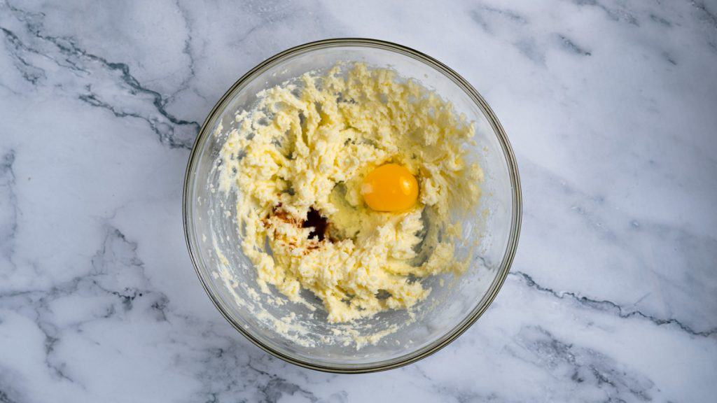 Egg and vanilla extract added to creamed butter