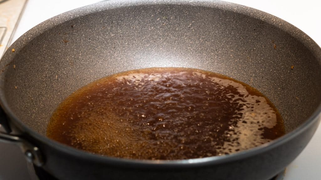 Boiling a sauce in a large saute pan