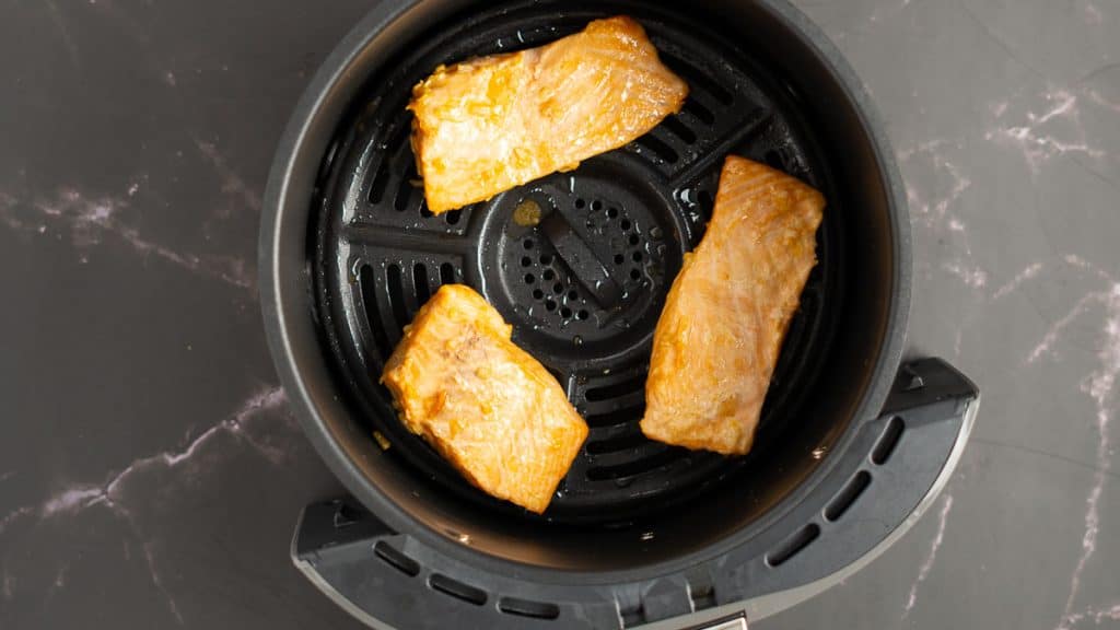 Air fried teriyaki salmon that is half-way cooked