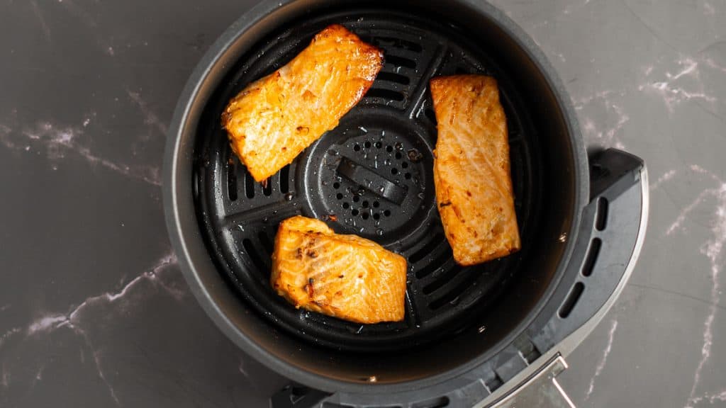 Air fried teriyaki salmon in an air fryer basket