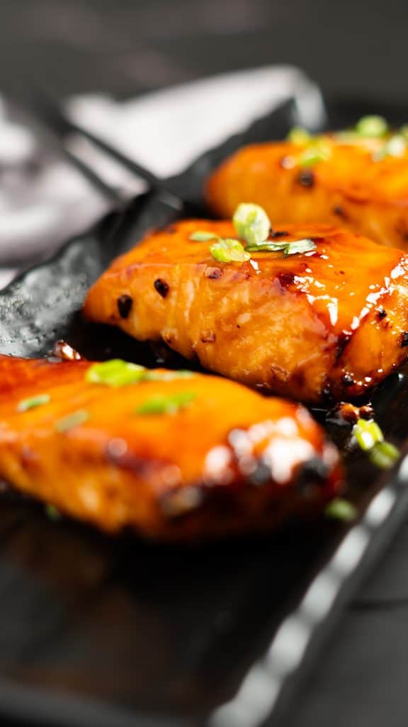 Air fried teriyaki salmon with green onions on top