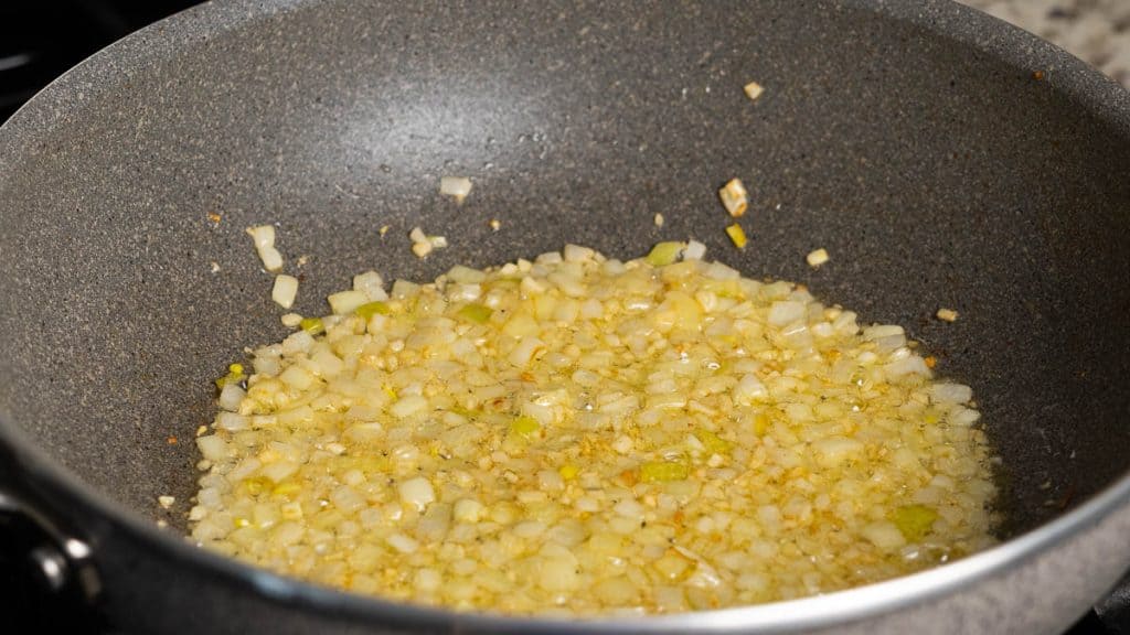 Frying onions and garlic in butter