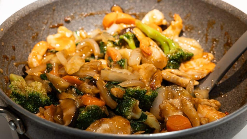 Stir-fried broccoli, carrot, shiitake mushroom, onions, chicken and shrimp