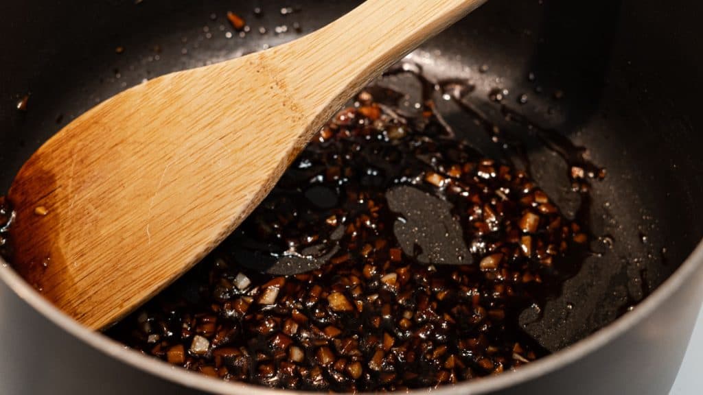 Thick soy garlic sauce in a sauce pan