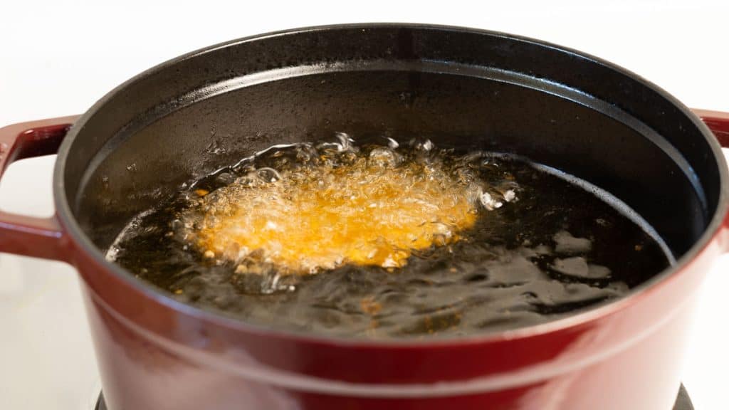 Deep frying pork katsu in a Dutch oven
