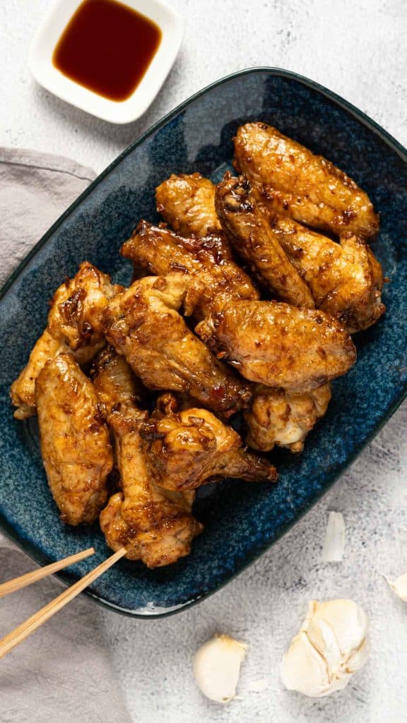Baked soy garlic chicken wings on a plate