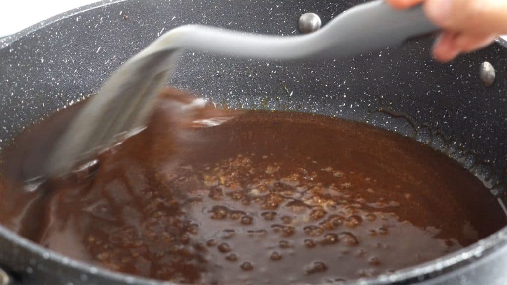 Simmering Japanese Hamburg steak sauce in a skillet