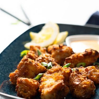 Air-fried karaage (Japanese fried chicken) with a lemon and sriracha mayo and green onions on top