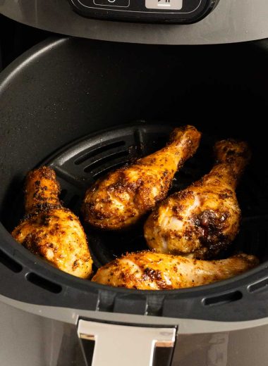 Air fried chicken drumsticks in an air fryer basket
