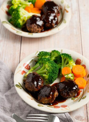 Japanese hamburg steak with sauce and broccoli and carrots