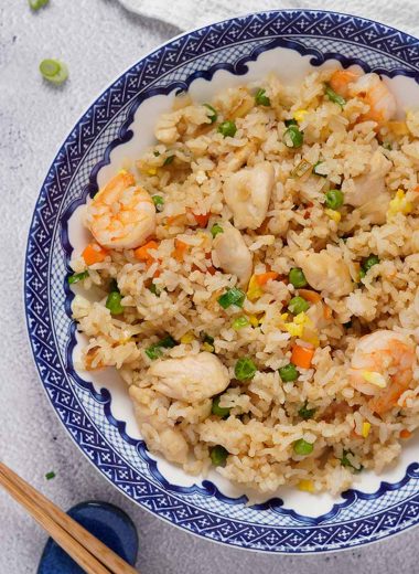 Shrimp and chicken fried rice with peas and carrots